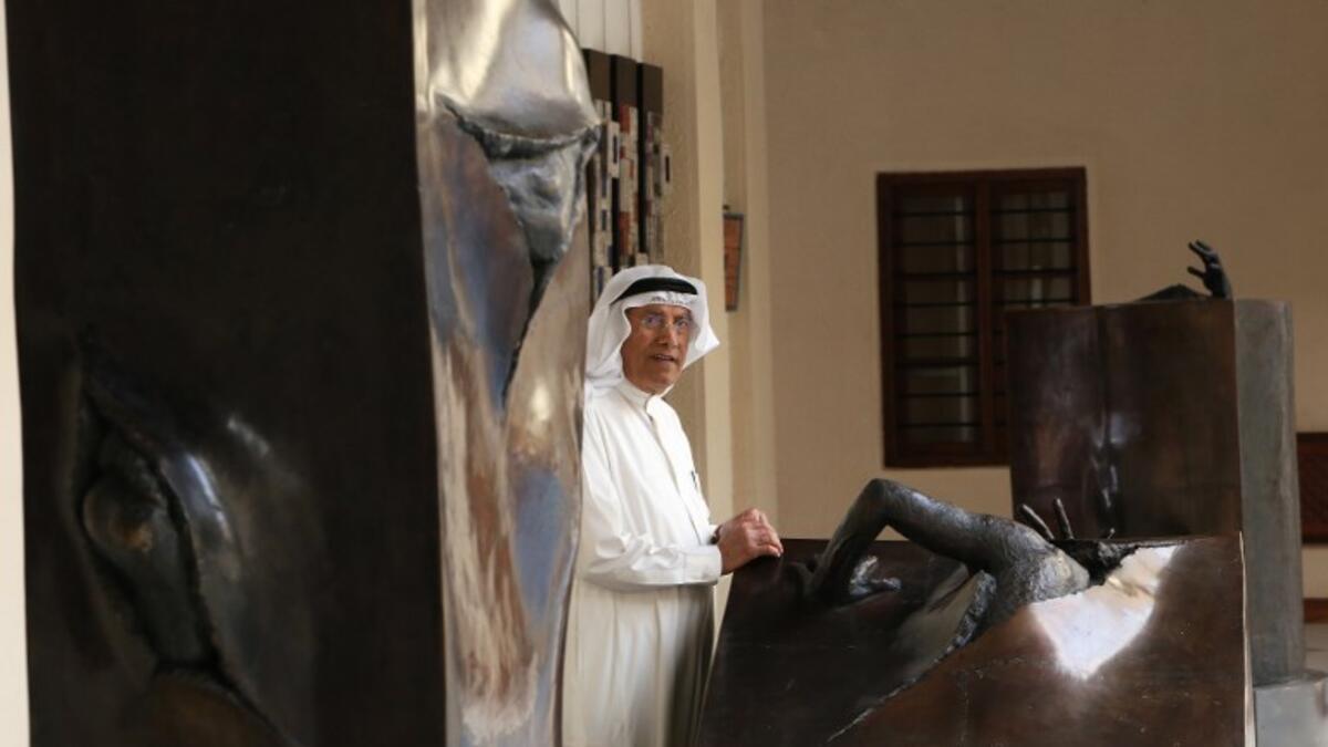 Kuwaiti sculptor Sami Mohammed poses next to his work at the Museum of Modern Art in Kuwait City on October 4, 2018. 
Yasser Al-Zayyat / AFP