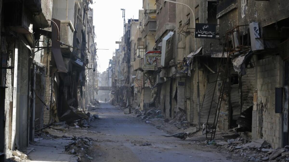 Destroyed buildings are seen in the Palestinian camp of Yarmuk southern Damascus on November 1, 2018. 
LOUAI BESHARA / AFP