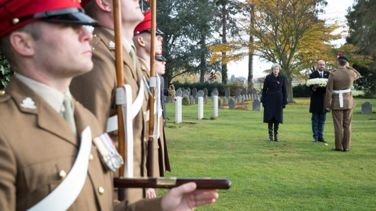 Britain's Prime Minister Theresa May (3rdR) and Belgium's Prime Minister Charles Michel (2ndR) attend to a commemoration of the 100th anniversary of the end of the First World War at the Saint-Symphorien Military Cemetery, near Mons, on November 9, 2018. 
BENOIT DOPPAGNE / Belga / AFP