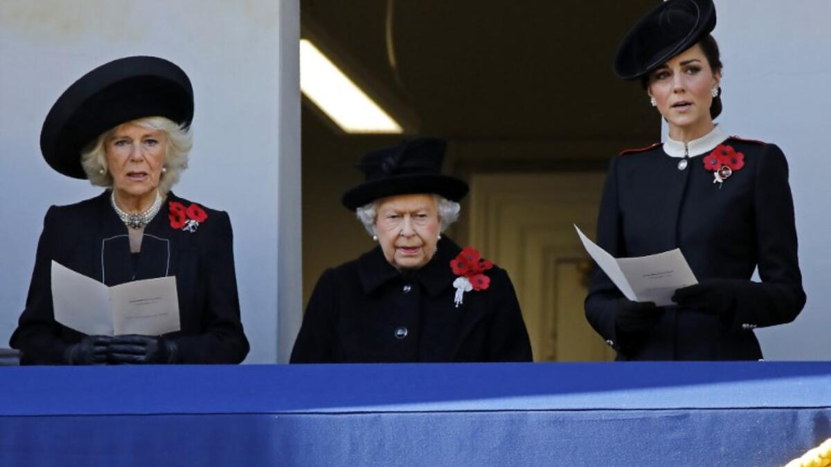 Britain's Camilla, Duchess of Cornwall (L), Britain's Queen Elizabeth II (C) and Britain's Catherine, Duchess of Cambridge (R) attend the Remembrance Sunday ceremony at the Cenotaph on Whitehall in central London, on November 11, 2018. 
Tolga AKMEN / AFP