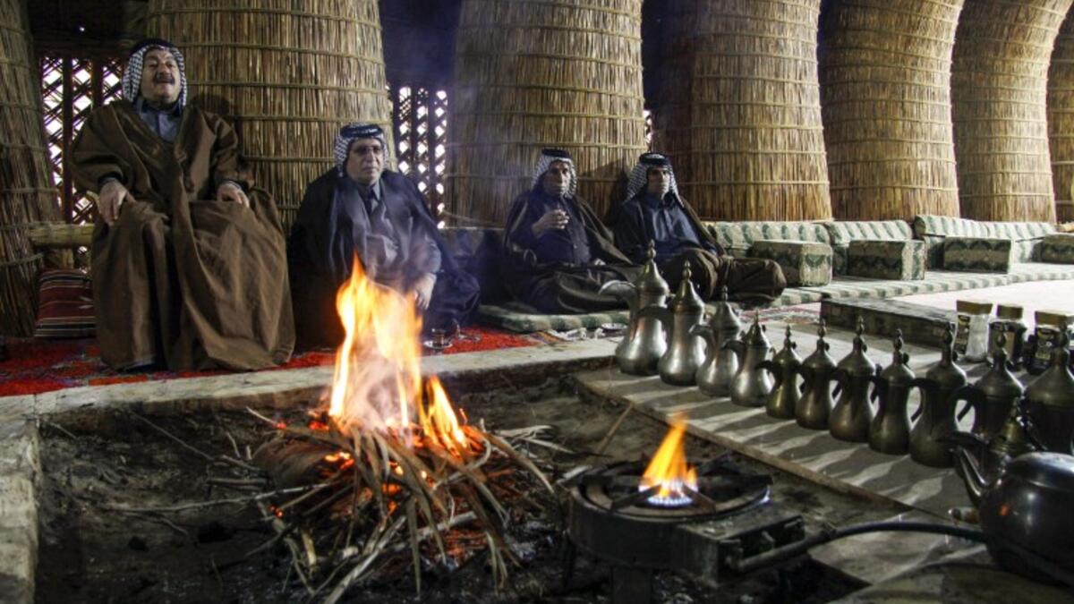 Members of an Iraqi clan gather inside a straw tent in the town of Mishkhab, south of Najaf on November 15, 2018. 
Haidar HAMDANI / AFP