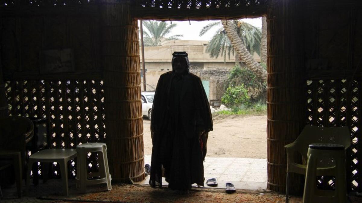 A member of an Iraqi clan enters a straw tent in the town of Mishkhab, south of Najaf on November 15, 2018. 
Haidar HAMDANI / AFP