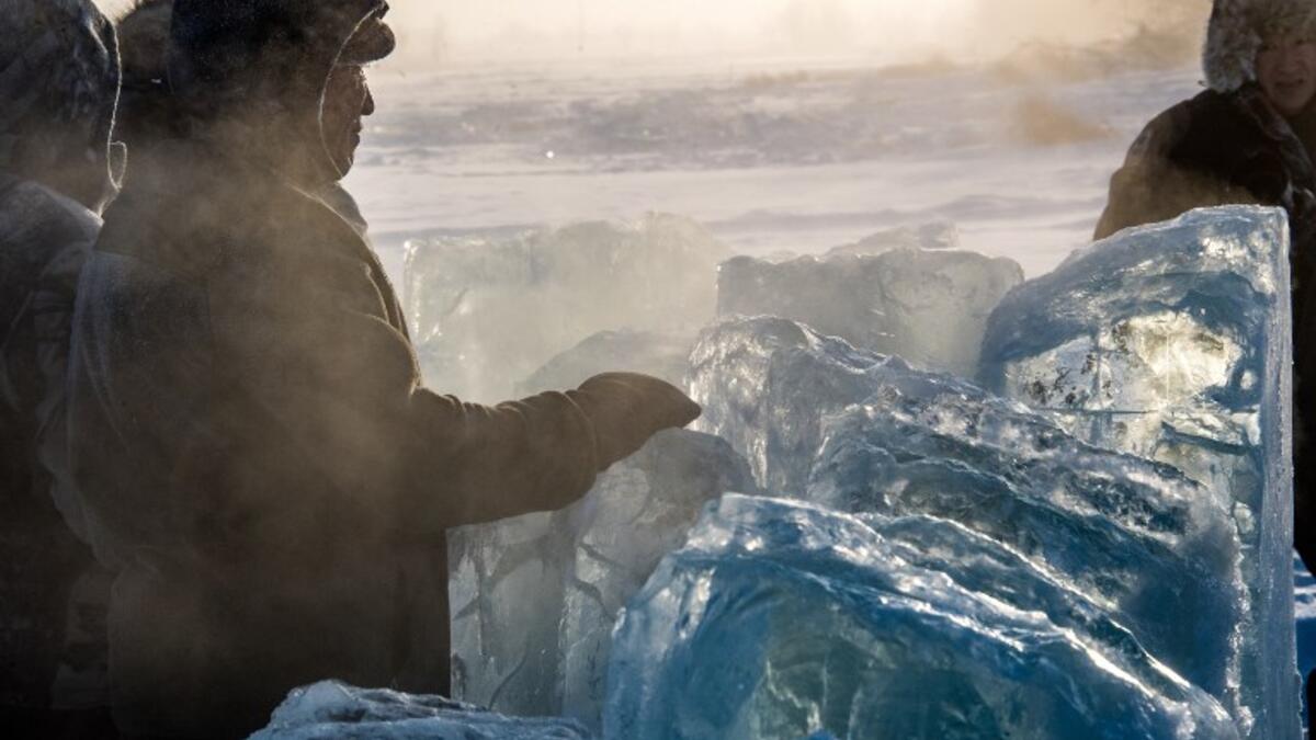 Villagers harvest ice from a local lake near the settlement of Oy, some 70 km south of Yakutsk, with the air temperature at about minus 41 degrees Celsius.
Mladen ANTONOV / AFP