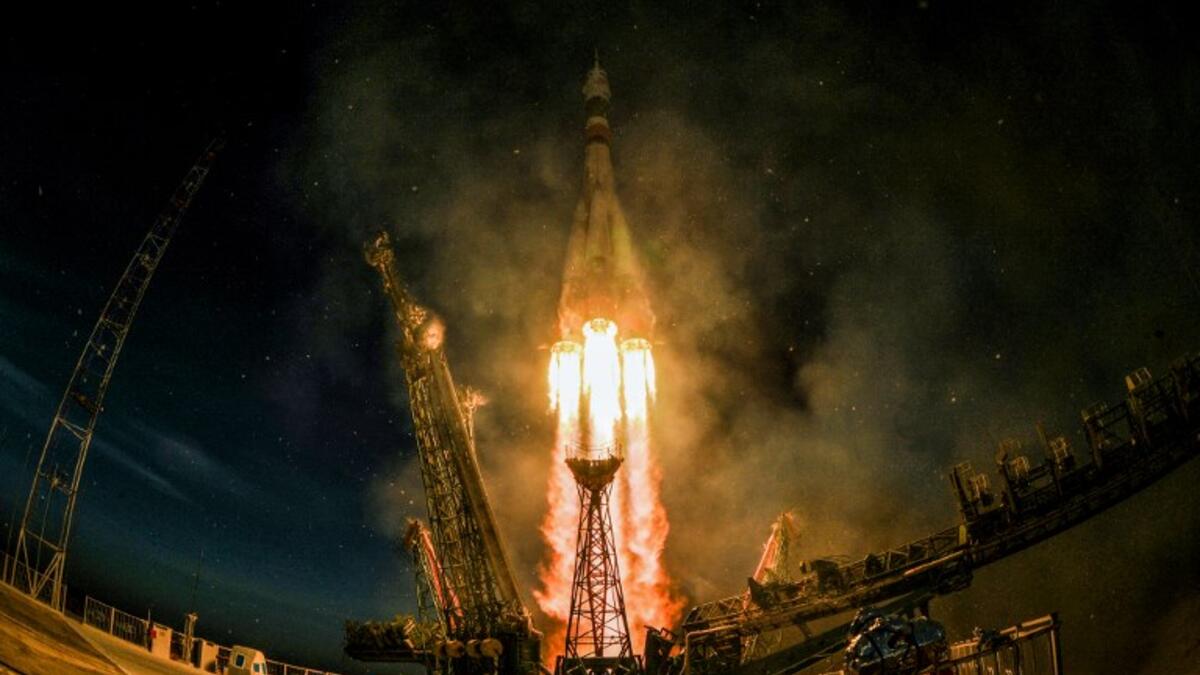 A Soyuz MS-11 rocket carrying Russian, American and Canadian astronauts takes off from the Baikonur Cosmodrome on December 3, 2018 before reached orbit later, the first manned mission since a failed launch in October. 
Kirill KUDRYAVTSEV / AFP