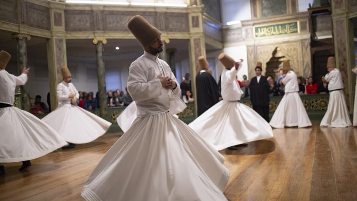 Whirling dervishes perform during a ceremony marking the anniversary of the death of Jelaleddin Mevlana Rumi, Sufi mystic, poet and founder of the sufism on December 16, 2018 at Galata Mevlihanesi in Istanbul. 
Yasin AKGUL / AFP