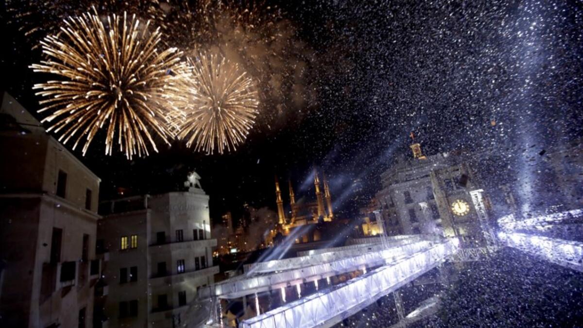Fireworks explode over downtown Beirut, Lebanon, during New Year's celebrations on January 1, 2019. 
Anwar AMRO / AFP