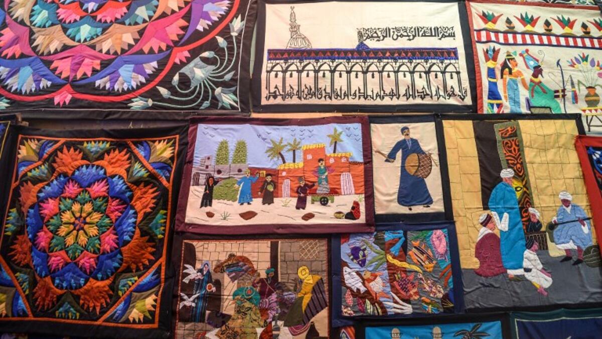 This picture shows tapestries hanging on the wall of a shop in Khayamiya Street, or the Street of Tent-makers, in the old city of the Egyptian capital Cairo. Mohamed el-Shahed / AFP