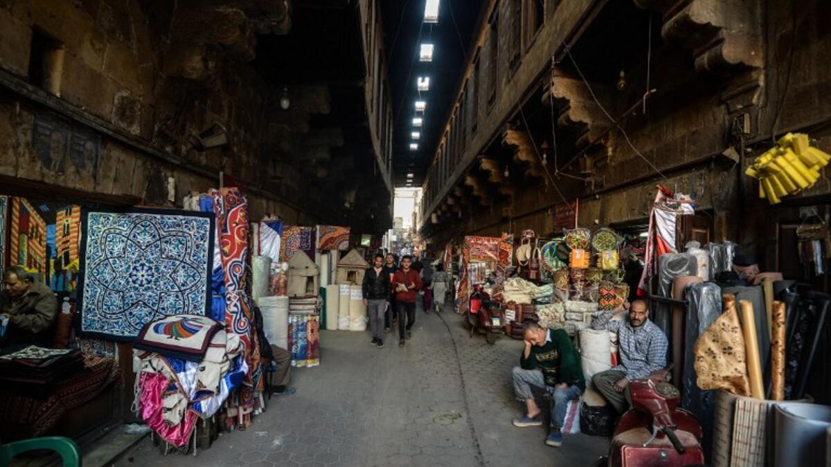 This picture shows a view of shops along the roofed Khayamiya Street, or the Street of Tent-makers, in the old city of the Egyptian capital Cairo. Mohamed el-Shahed / AFP