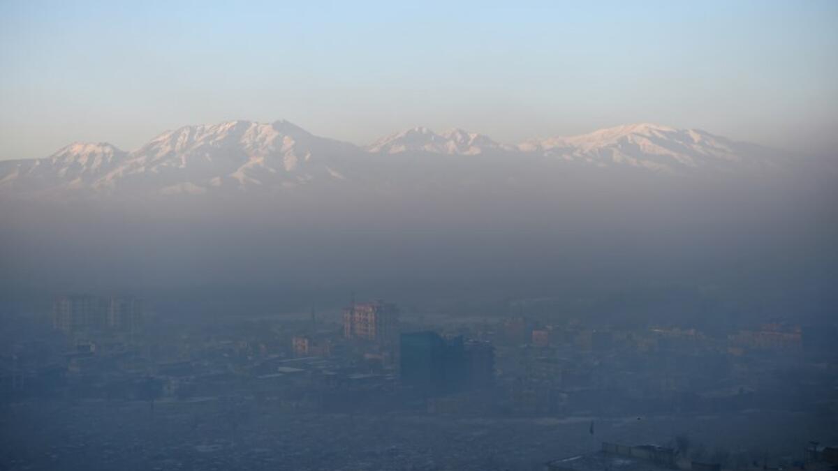 This photograph shows a general view of residential areas amid heavy smog conditions in Afghanistan's capital Kabul. 
WAKIL KOHSAR / AFP