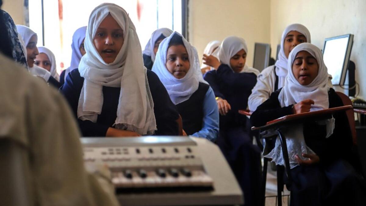 Children attend a music class at the Al-Nawras school in Taez, Yemen's third city, in the country's southwest
AHMAD AL-BASHA / AFP