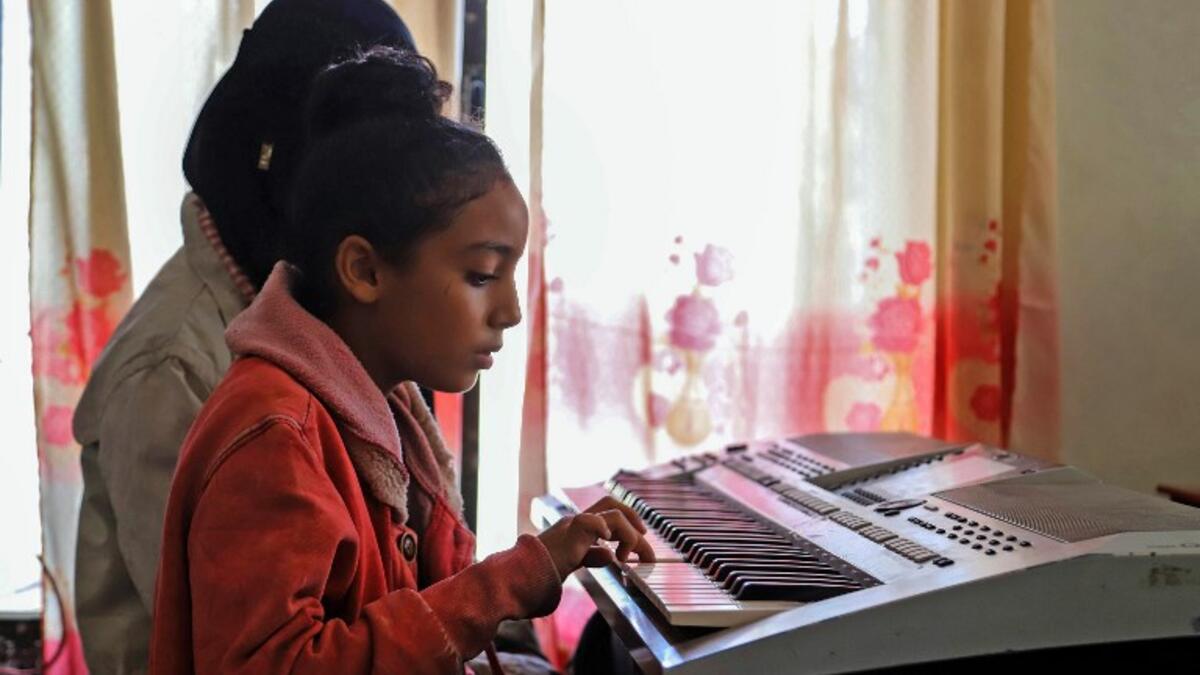 Children attend a music class at the Al-Nawras school in Taez, Yemen's third city, in the country's southwest
AHMAD AL-BASHA / AFP