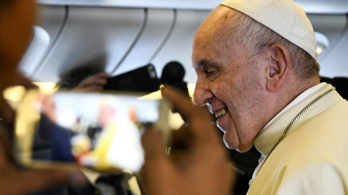 Pope Francis arrives to speak to reporters aboard a plane on his way to Abu Dhabi on February 3, 2019. 
Vincenzo PINTO / AFP