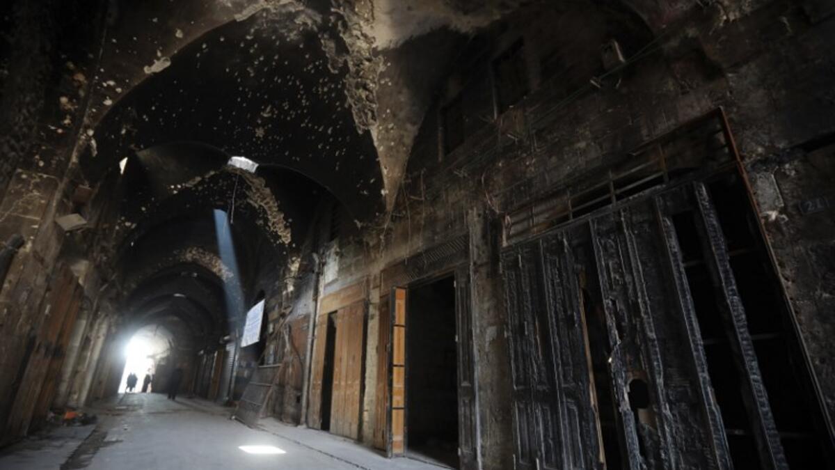 A general view shows the damaged inflicted on the Old Aleppo markets in the old quarter of Syria's second city of Aleppo 
LOUAI BESHARA / AFP