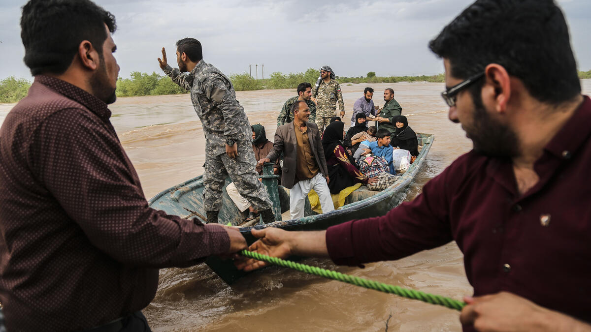 Iranian soldiers help civilians in a flooded area in a village around the city of Ahvaz, in Iran's Khuzestan province
Mehdi Pedramkhoo / TASNIM NEWS / AFP