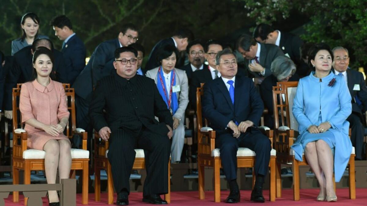 North Korea's leader Kim Jong Un (2L) and his wife Ri Sol Ju (L) sit with South Korea's President Moon Jae-in (2R) and his wife Kim Jung-sook (R) during a farewell ceremony  at the end of a  "threshold of a new history" summit. Korea Summit Press Pool / AFP