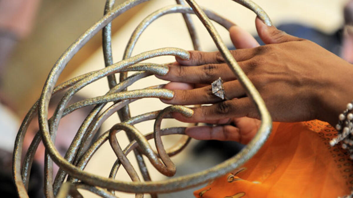 American Lee Redmond nearly 30 years to grown her nails out to the record-holding 28 feet, 4.5 inches in February 2008. The longest single nail was her right thumb, which reached to 2 feet, 11 inches. (AFP/ File Photo)