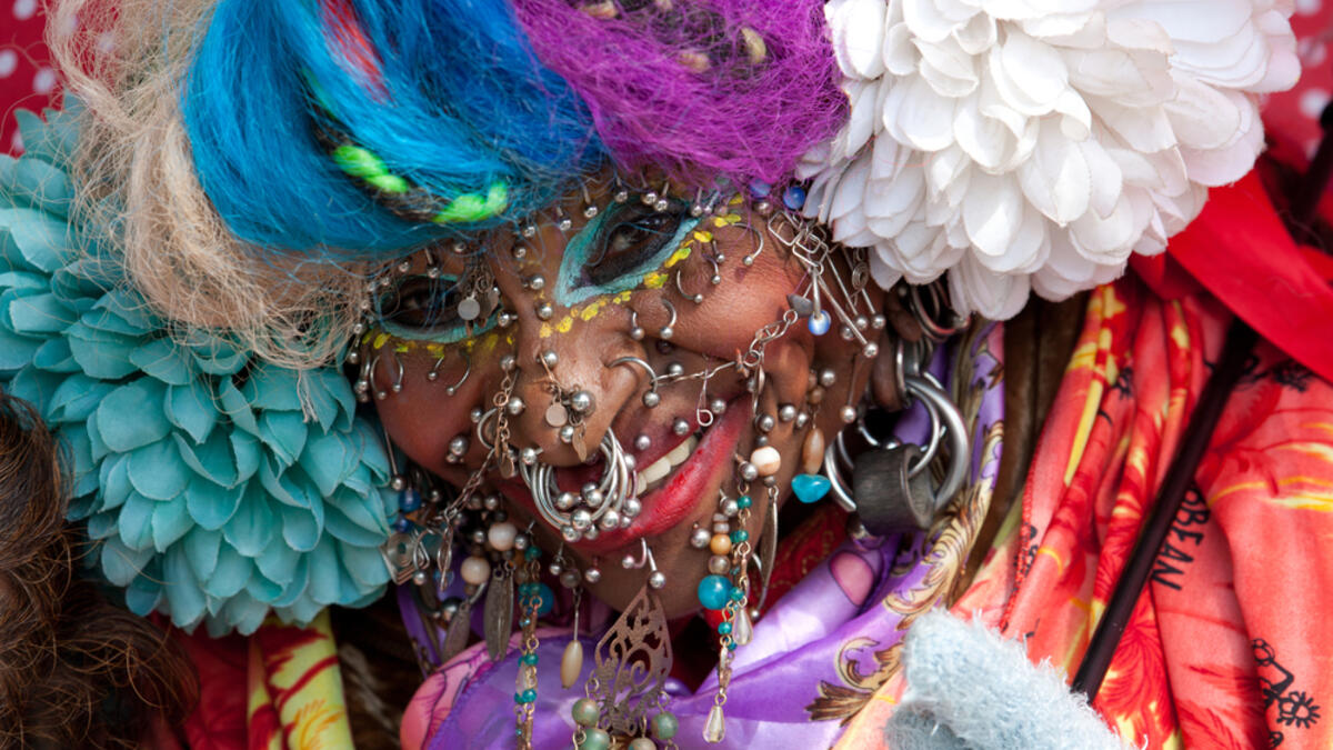 World's most pierced woman Elaine Davidson poses for photographers at the photocall for the 100 millionth copy of the Guinness World Records in the Tate Modern on November 11, 2003 in London. (Shutterstock/ File Photo)