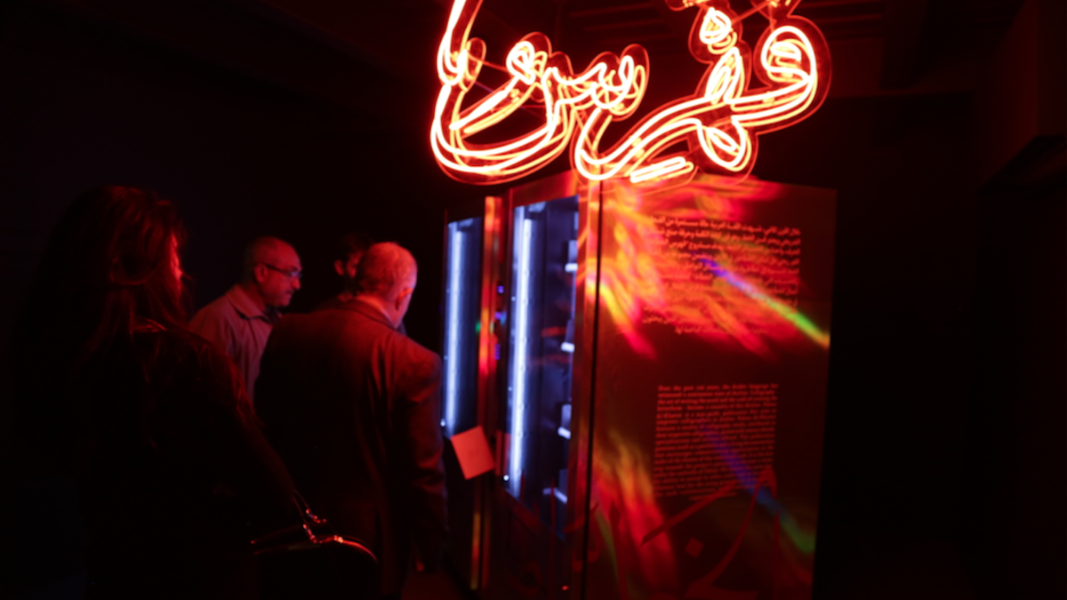 Crowdfunding through a vending machine is how Yousef Abedrabbo and Omar Al-Zo’bi are mixing modern neon lights with traditional calligraphy, at the same time as distributing the works and contacts of these professional modern scribes.  (Al Bawaba/Salim Essaid)