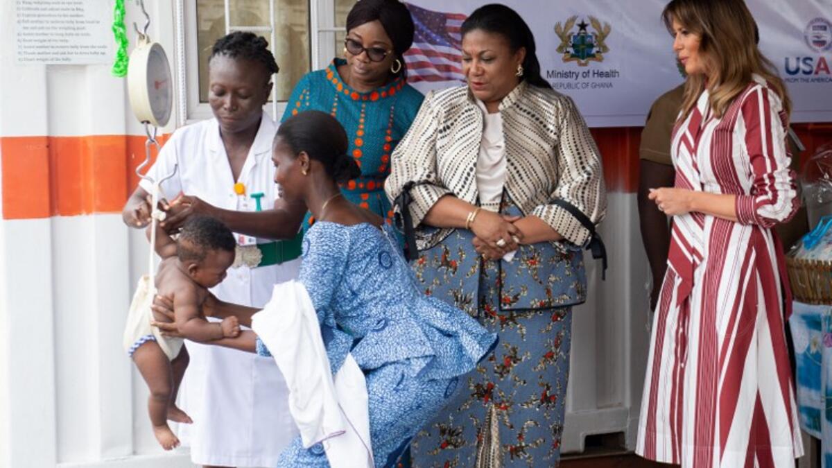 US First Lady Melania Trump (R) and Rebecca Akufo-Addo (3rdR) watch as a baby is weighed during a visit to the Greater Accra Regional Hospital in Accra, on October 2, 2018. (SAUL LOEB / AFP)