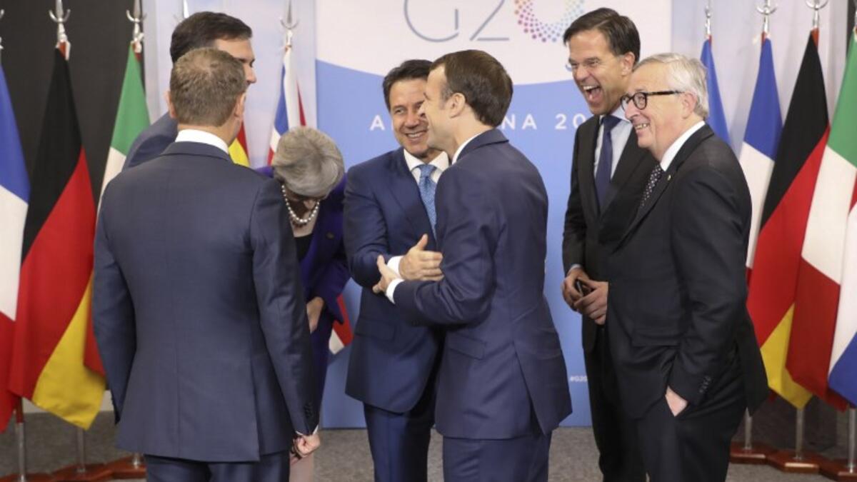 (L-R) the president of the European Council Donald Tusk, Spanish Prime Minister Pedro Sanchez (behind), British Prime Minister Theresa May, Italian Prime Minister Giuseppe Conte, French President Emmanuel Macron, the Netherland's Prime Minister Mark Rutte and the president of the European Commission Jean Claude Juncker. 
Ludovic MARIN / AFP