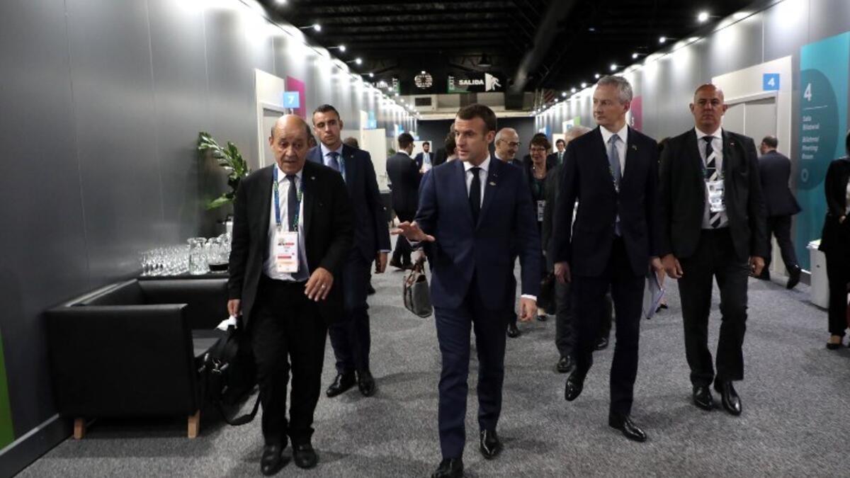 France's President Emmanuel Macron (C) walsk next to some of his ministers in the sidelines of the G20 Summit in Buenos Aires, on November 30, 2018.
Ludovic MARIN / AFP