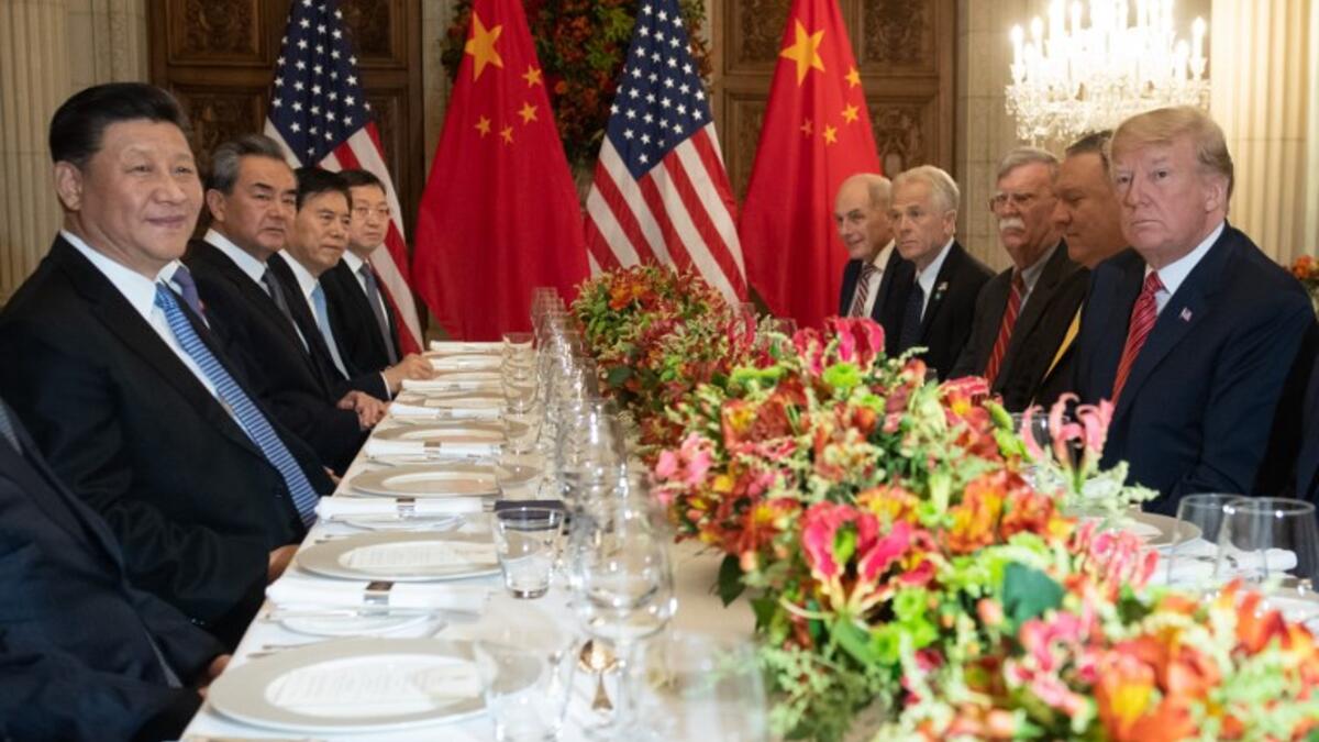 US President Donald Trump (R) US Secretary of State Mike Pompeo (2-R) and members of their delegation hold a dinner meeting with China's President Xi Jinping (L) China’s Foreign Affairs Minister Wang Yi (2-L) and Chinese government representatives, at the end of the G20 Leaders' Summit in Buenos Aires, on December 01, 2018.
SAUL LOEB / AFP