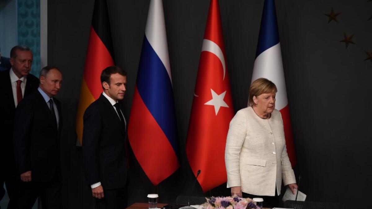 German Chancellor Angela Merkel (R), Russian President Vladimir Putin (2ndL), Turkish President Recep Tayyip Erdogan (L) and French President Emmanuel Macron (C), arrive for a conference during a summit on Syria. (OZAN KOSE / AFP)