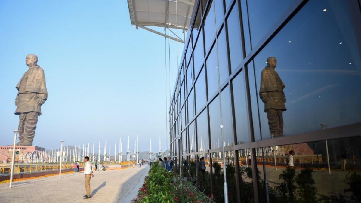 A reflection of the "Statue Of Unity", the world's tallest statue dedicated to Indian independence leader Sardar Vallabhbhai Patel, is pictured during its inauguration overlooking the Sardar Sarovar Dam. (SAM PANTHAKY / AFP)