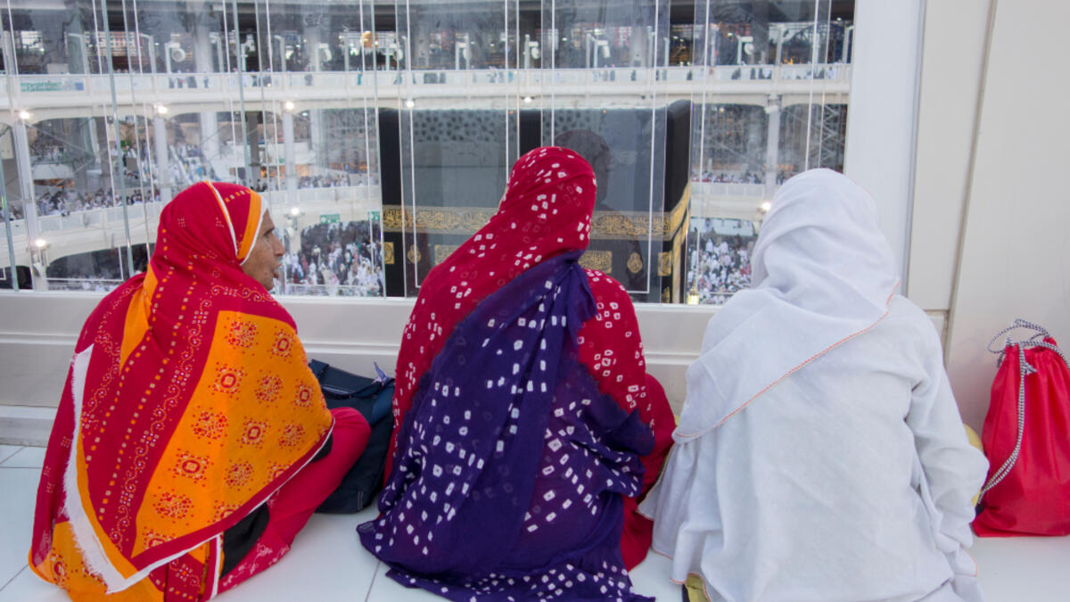 Three Muslim women watch the Kaabah in Makkah, Saudi Arabia (Shutterstock/File Photo)