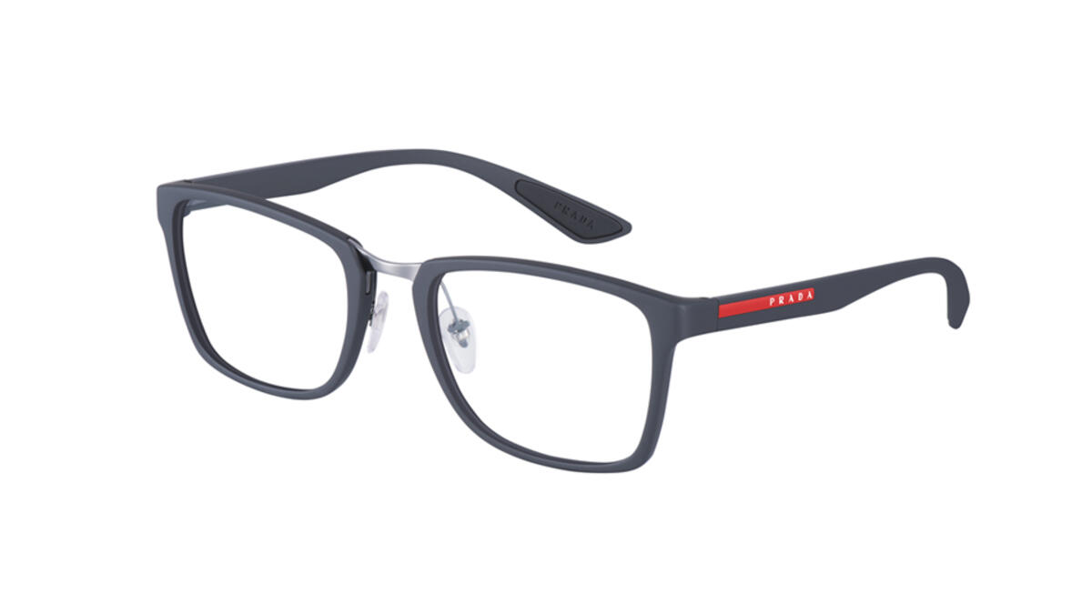 An optical take on the new Prada Linea Rossa Flask collection. Sports codes are the inspiration behind the squared design of the nylon front, enhanced by the modern appeal of the metal bridge. The rubber coating ensures a comfortable fit. Available in shades of Black, Grey, Dark Chocolate, White, and Amaranth.