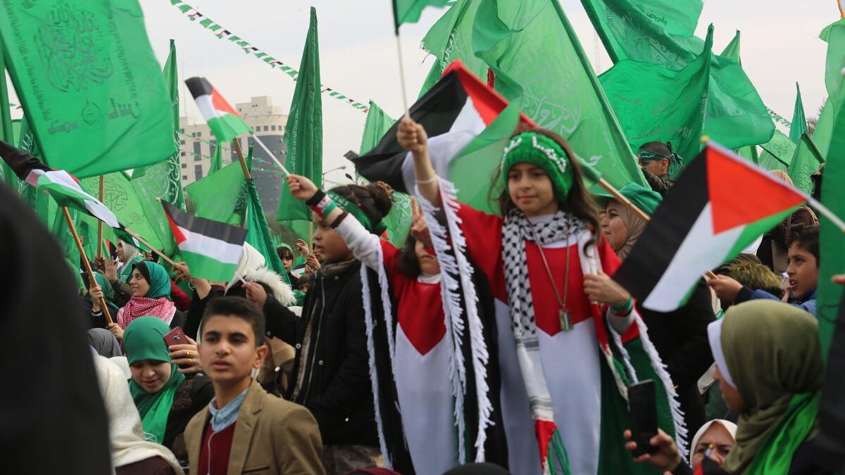 Palestinians attend a rally marking the 31st anniversary of Hamas' founding. (Twitter)