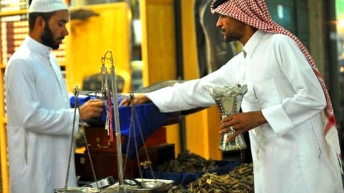 KSA: A Saudi man buys incense outside a shop at the Mecca market in central Riyadh in readiness for Eid, 
the holiday following Ramadan. Traditional spicy scents are prevalent, as people enjoy the setting the mood, and marking
the festive flavor of the occasion.