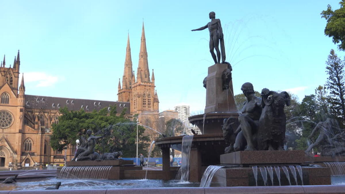 The J. F. Archibald Memorial Fountain, Hyde Park, Sydney, New South Wales. The design of the fountain is a mixture of Greek and Roman influences that features the god Apollo encircled by other mythical beings that spray water to the delight of visitors.