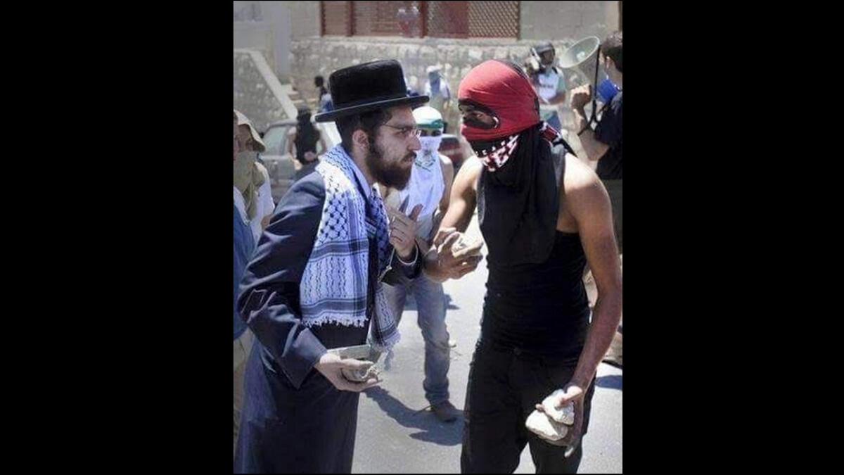 orthodox jew and palestinian throw stones together