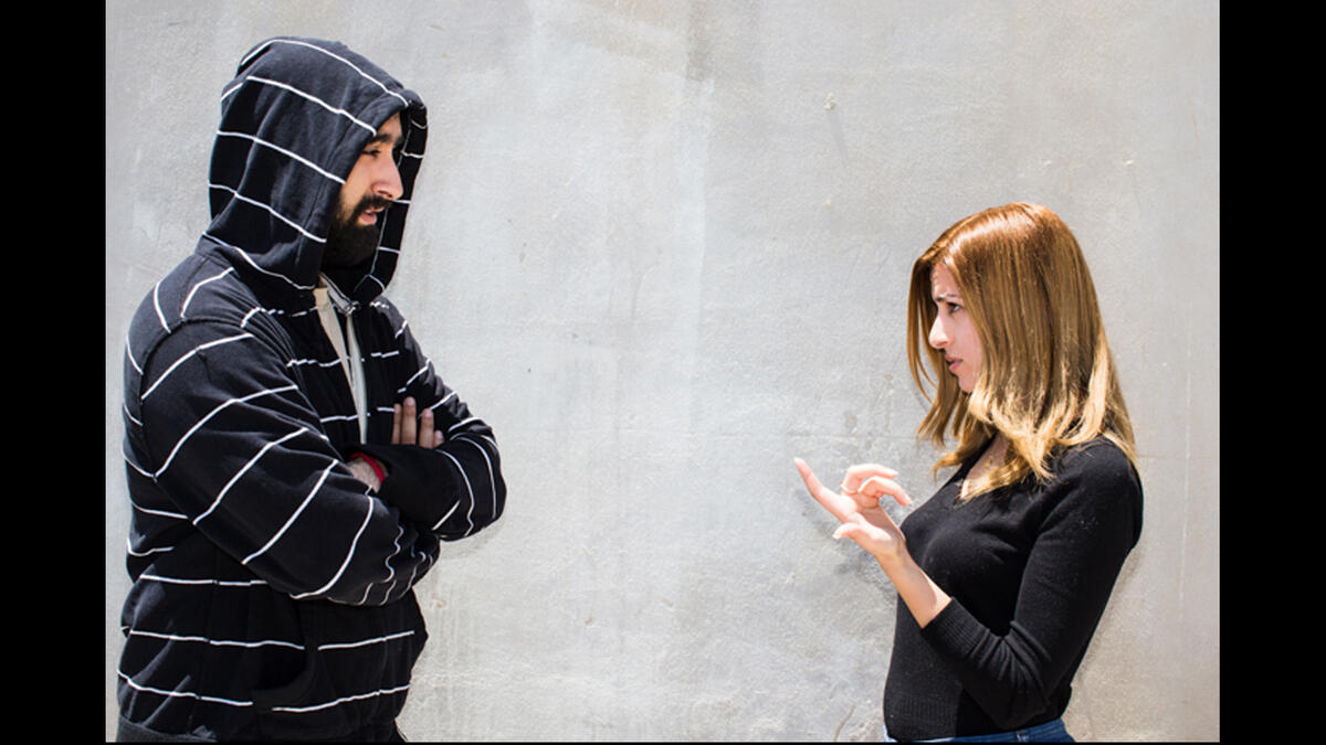 Hand twist what's up Arabic hand sign