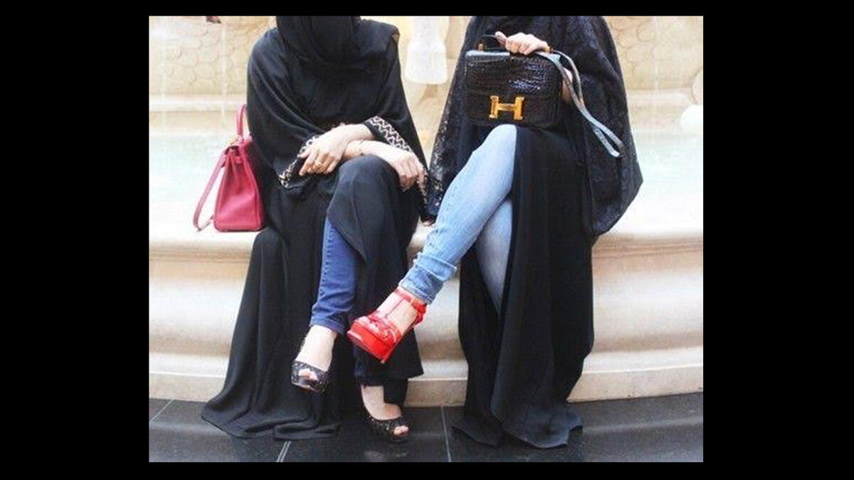 How does bling jive with modesty? Gulf women wear elegant black abaya, modest robes that help diminish economic divisions. But consider sleeves encrusted with stitches and stones, seductive stilettos, and draped on clunky jewels. Designer handbags and footwear are talismans of privilege that scream to be noticed, deflating the virtue of modesty.