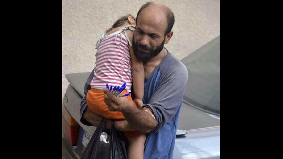 Syrian refugee selling pens