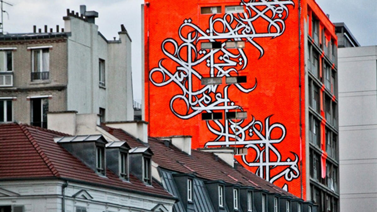 eL Seed graffiti wall Arab artist Paris