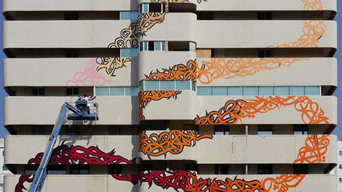 eL Seed graffiti wall Arab artist Sharjah