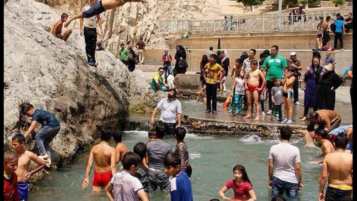 Tell your mother to put down the paper fan! Vigorous action uses lots of energy and raises body temperature. Better to burn those calories walking to the nearest cafe or mall to enjoy some time in free air conditioning.  Or do like these overheated Iranians at the Chesme-Ali recreational area near Tehran and go jump in the nearest public pool!