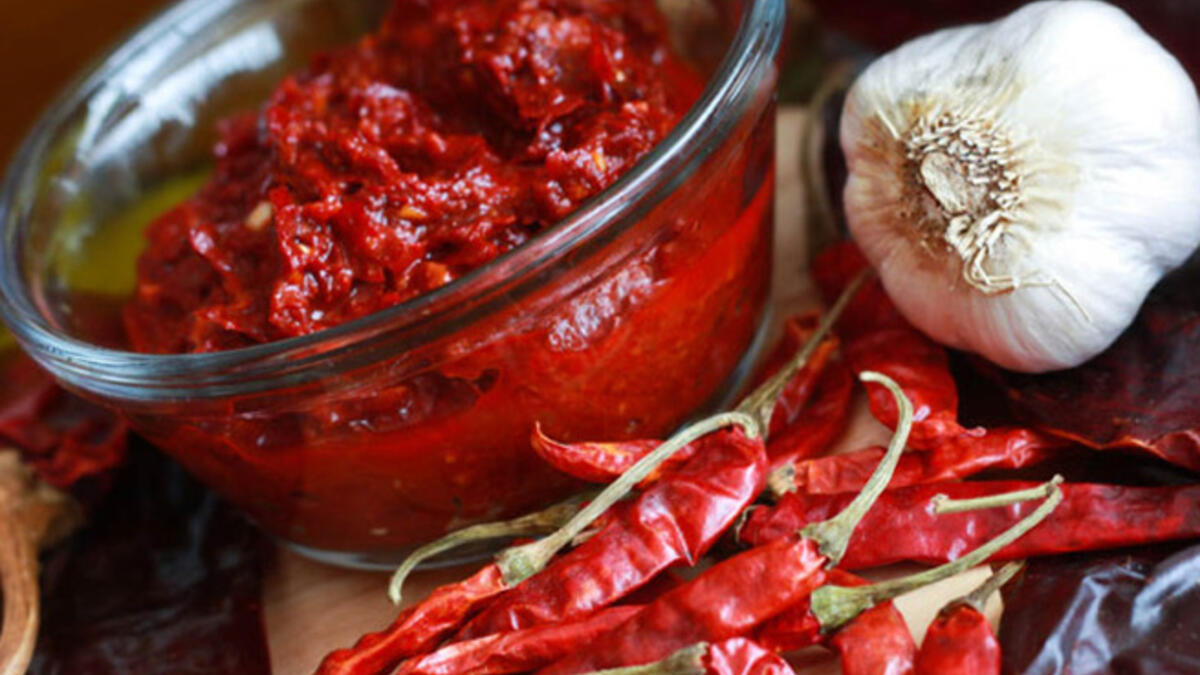 Spice up that shawarma with some shatta (hot sauce) or harissa (hot pepper paste). Steer towards spicy - it increases circulation and makes you sweat, which cools your skin.  It’s no coincidence that some of the hottest places have the spiciest food!. Eat often, but small, because the bigger the meal, the more energy you need to digest it.