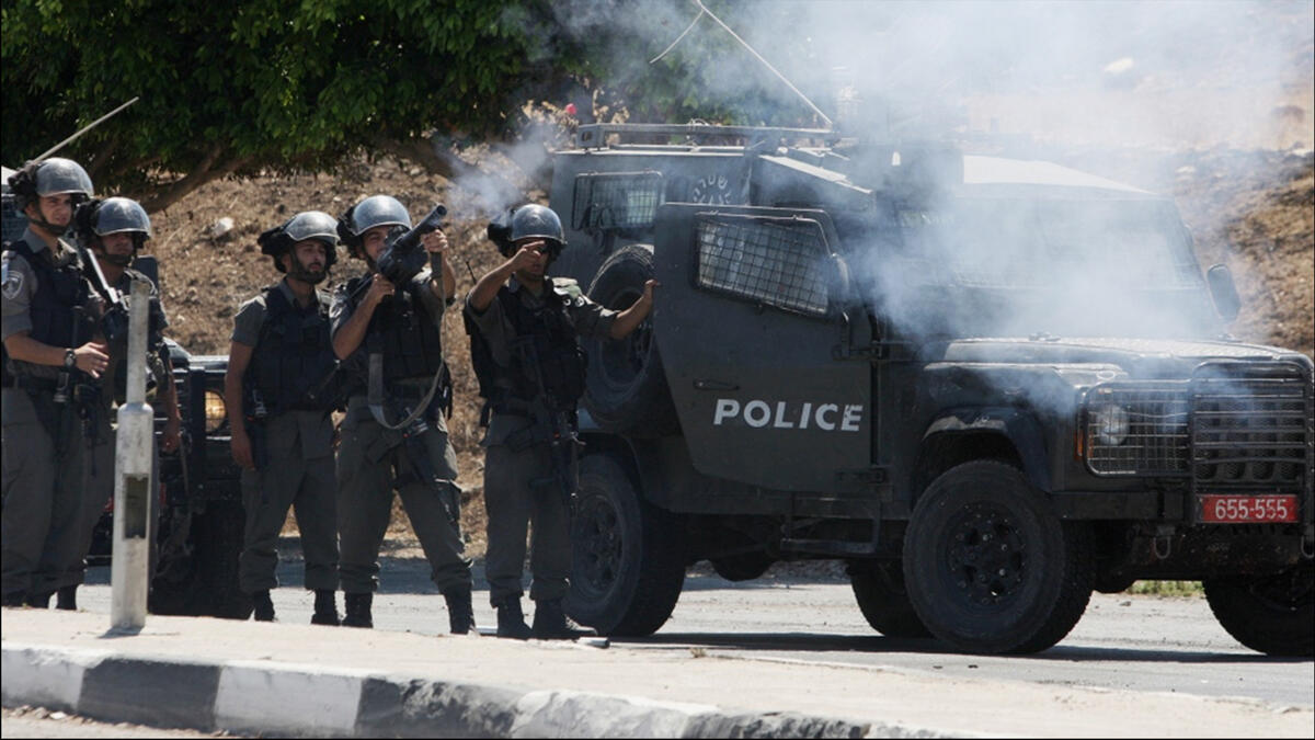 israeli soldiers fire at protesters