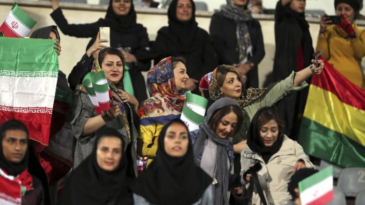 Iranian women take a selfie during the friendly football match between Iran and Bolivia at the Azadi Stadium in Tehran. (STR / AFP)