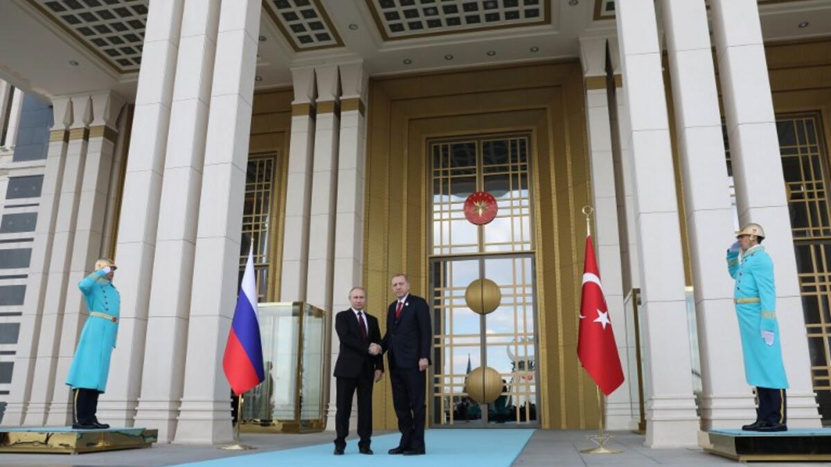 Greetings: Turkish President Tayyip Erdogan (R) shakes hands with his Russian counterpart Vladimir Putin prior to their meeting at the Presidential Palace in Ankara on April 3, 2018.  (ADEM ALTAN / AFP)