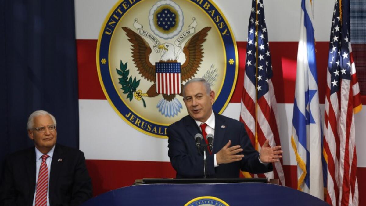 US ambassador to Israel David Friedman listens as Israel's Prime Minister Benjamin Netanyahu delivers a speech during the opening of the US embassy in Jerusalem on May 14, 2018. MENAHEM KAHANA / AFP