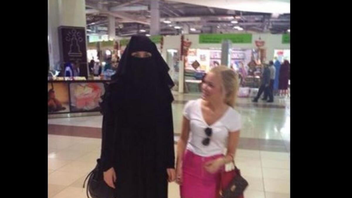 veiled woman and mini-skirted woman