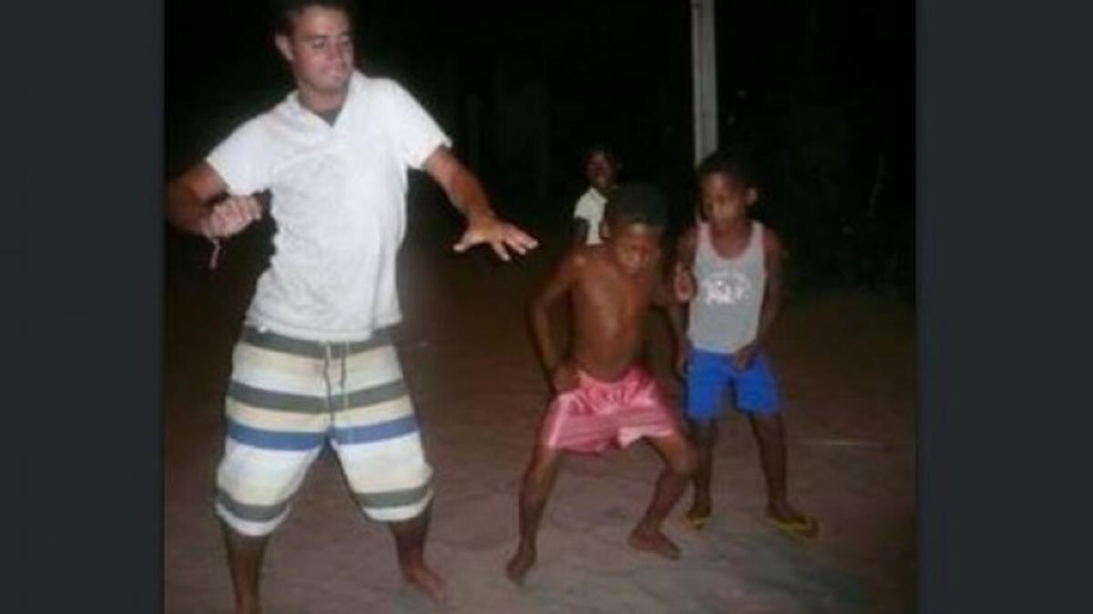silly white guy dancing with black kids
