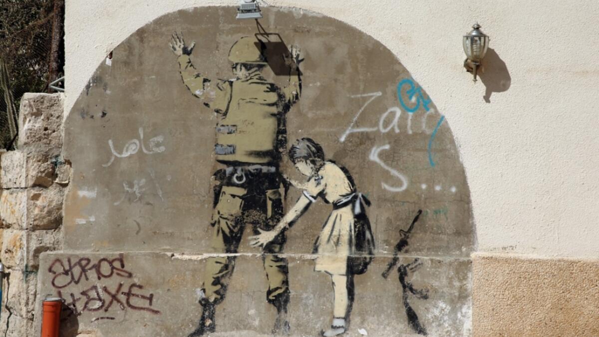 'Stop and Search', mural in the occupied West Bank town of Bethlehem  /AFP