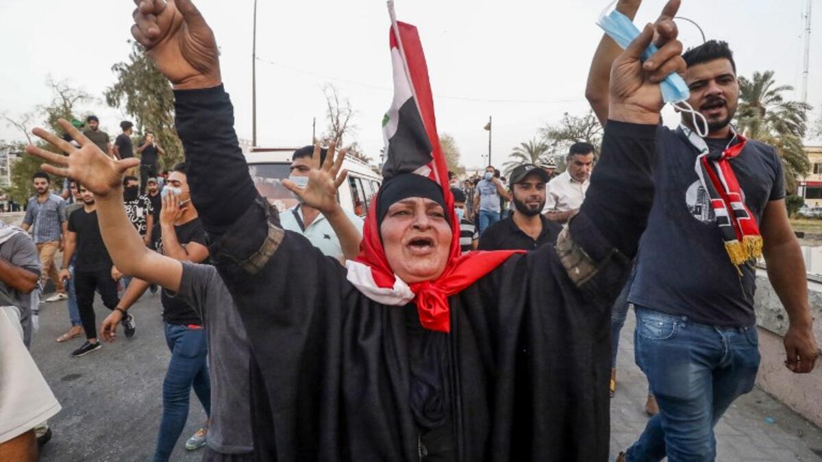 Iraqi protesters gesture and chant slogans as they gather in a demonstration against corruption and lack of basic services outside the local government headquarters in the southern city of Basra on September 2, 2018. 
Haidar MOHAMMED ALI / AFP
