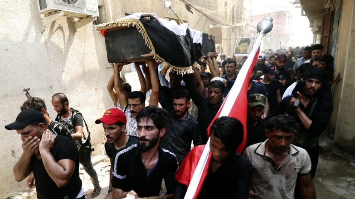 Iraqi protestors carry the coffin of a man on September 4, 2018, that family and Human rights activists claim was killed by bullet shots during the previous day, while demonstrating against the government and the lack of basic services, in the southern city of Basra.
Haidar MOHAMMED ALI / AFP